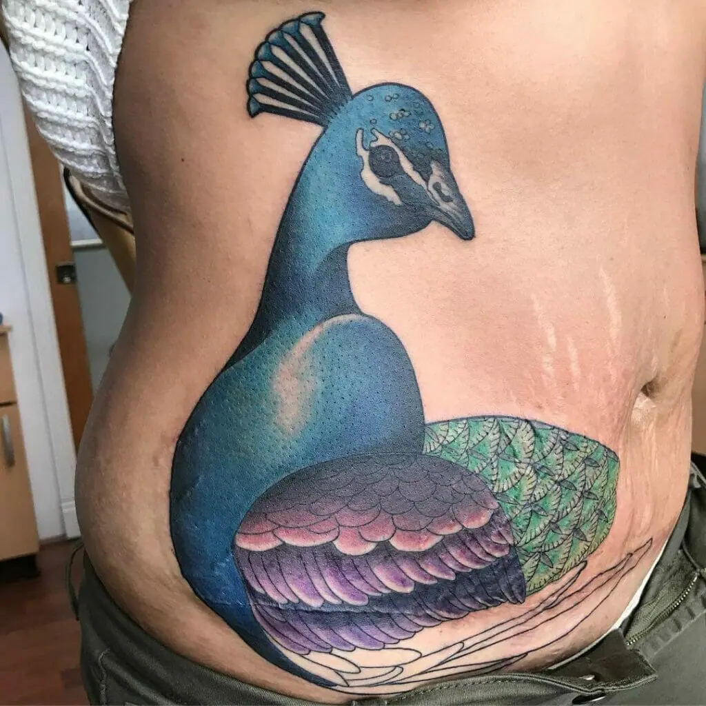 Mẫu tattoo che sẹo ở bụng cực độc đáo