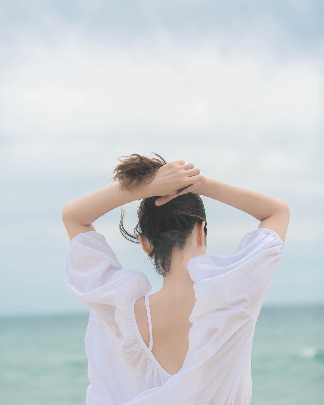 Ảnh chụp sau lưng check-in biển
